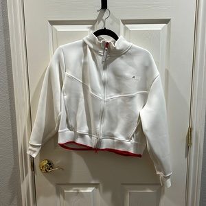 White zip-up sweatshirt by Adidas by Stella McCartney.